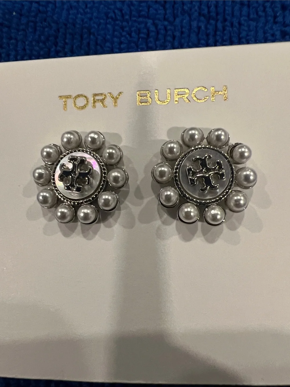 Tory Burch Kira Pearl Flower Stud Earrings, featuring a central Double T logo